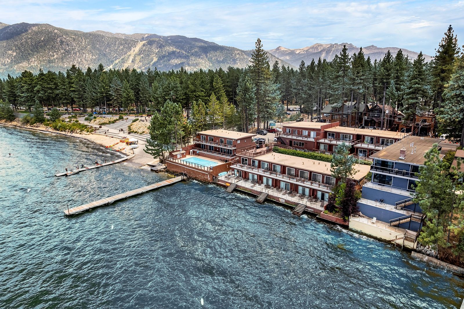 The Beachcomber Inn on the South Lake Tahoe shoreline, with the mountains behind.