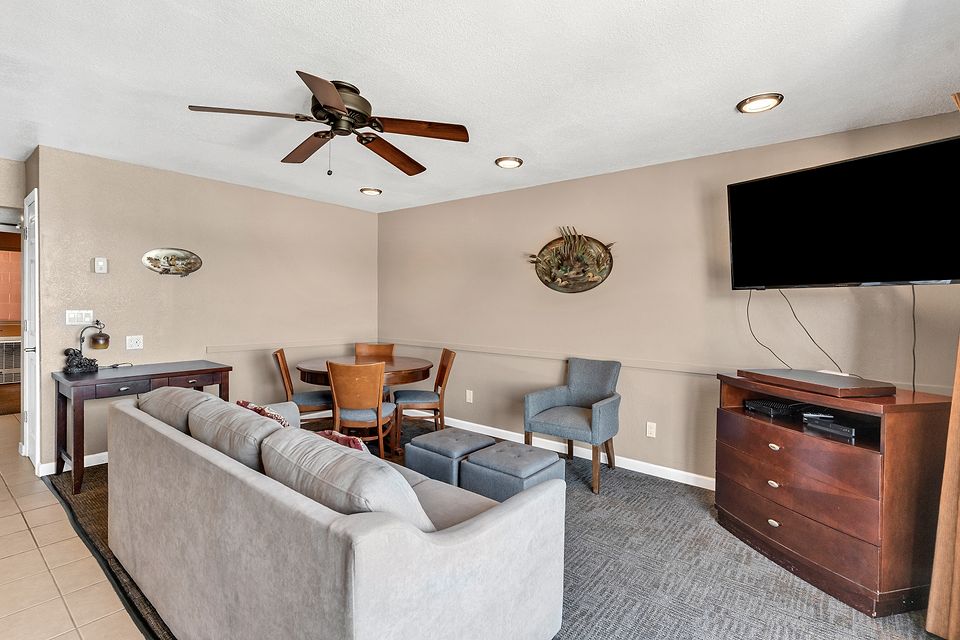 Living room with a sofa bed and TV, Unit A at the Beachcomber Inn