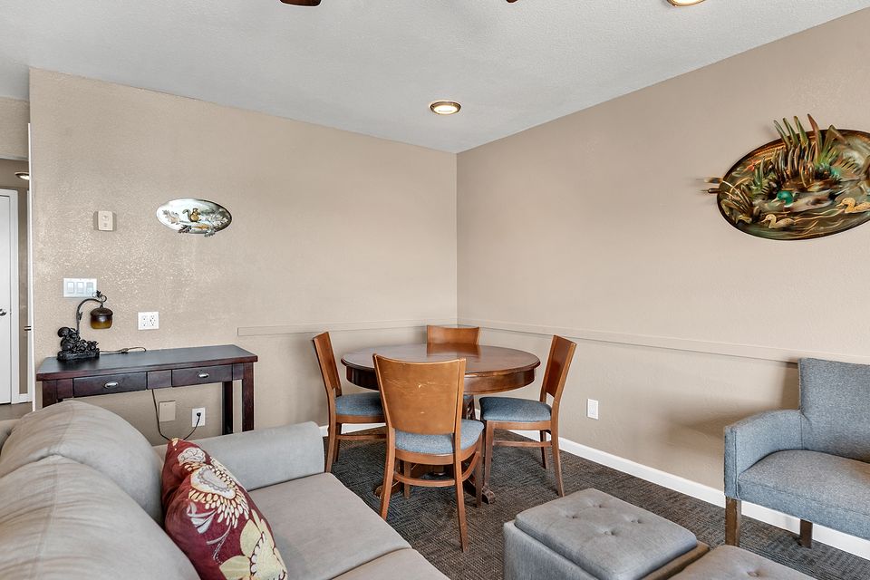 Dining table and living room, Unit A at the Beachcomber Inn