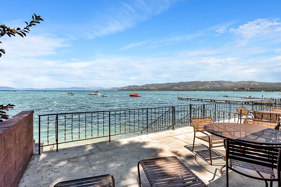 Private deck at the water's edge with a view of Lake Tahoe, Unit A at the Beachcomber Inn