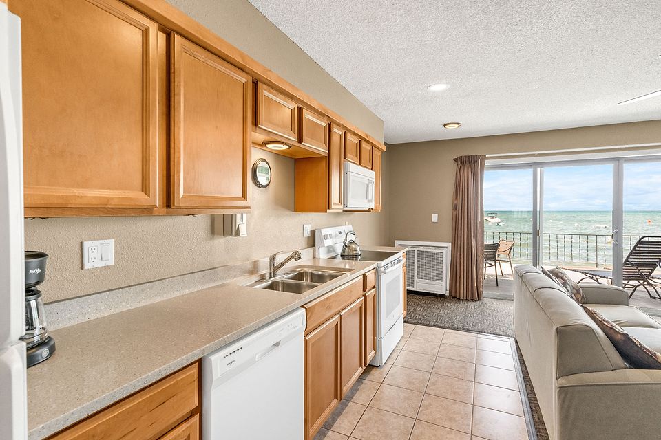 Full kitchen, with the lake through the slider, Unit B at the Beachcomber Inn