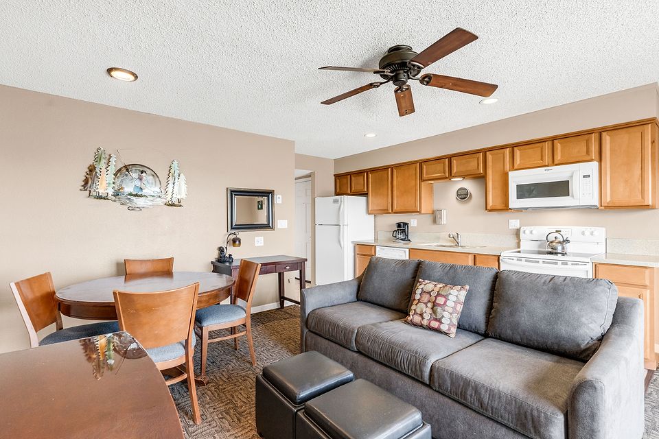 Dining table and living room, Unit B at the Beachcomber Inn