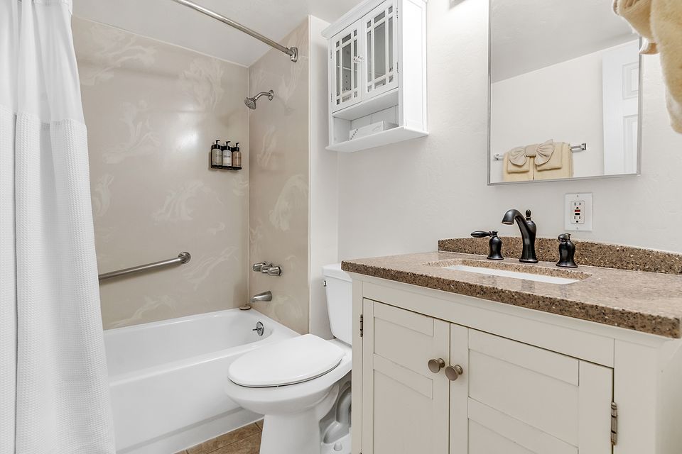 Bathroom with a tub and shower, Unit C at the Beachcomber Inn