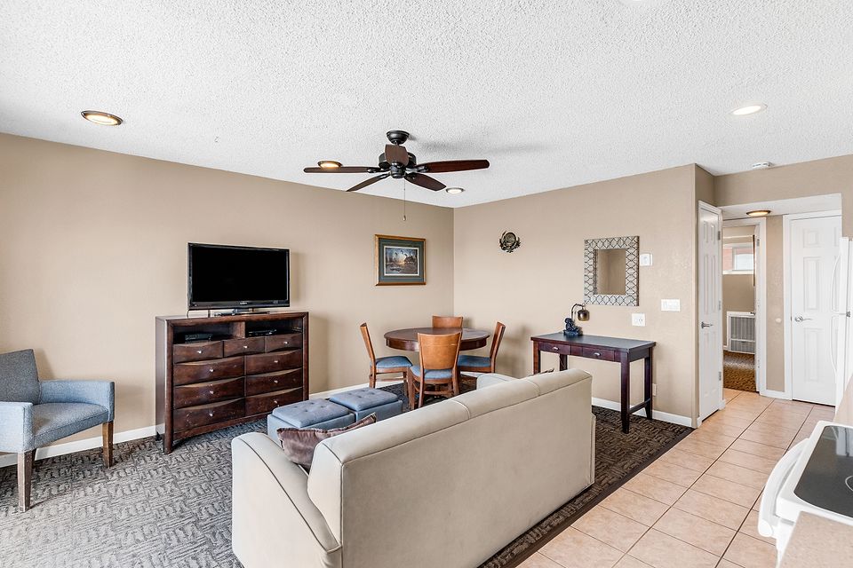 Living room with the TV and dining table, Unit D at the Beachcomber Inn