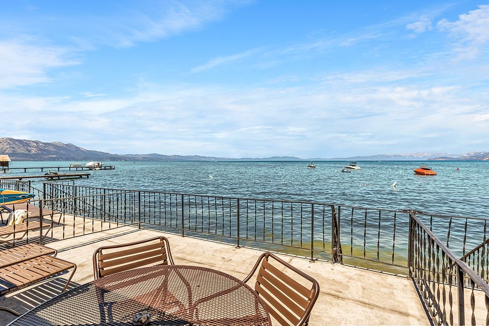 Private deck at the water's edge with a view of Lake Tahoe, Unit E at the Beachcomber Inn