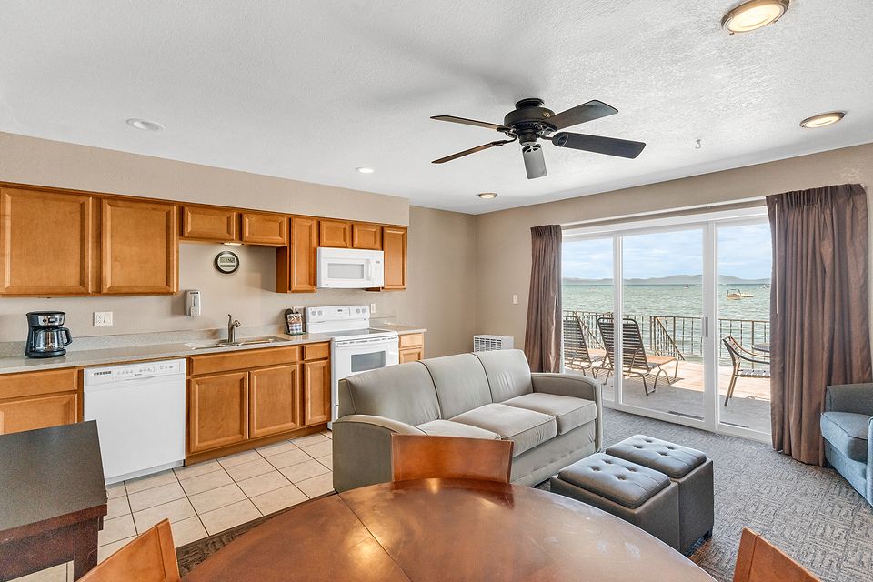Kitchen and living room with the lake through the slider, Unit F at the Beachcomber Inn