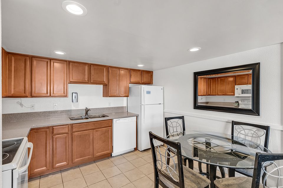 Full kitchen and dining table, Unit G at the Beachcomber Inn