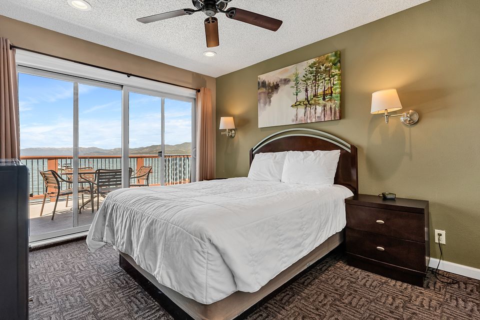 Bedroom with a view of Lake Tahoe, Unit G at the Beachcomber Inn