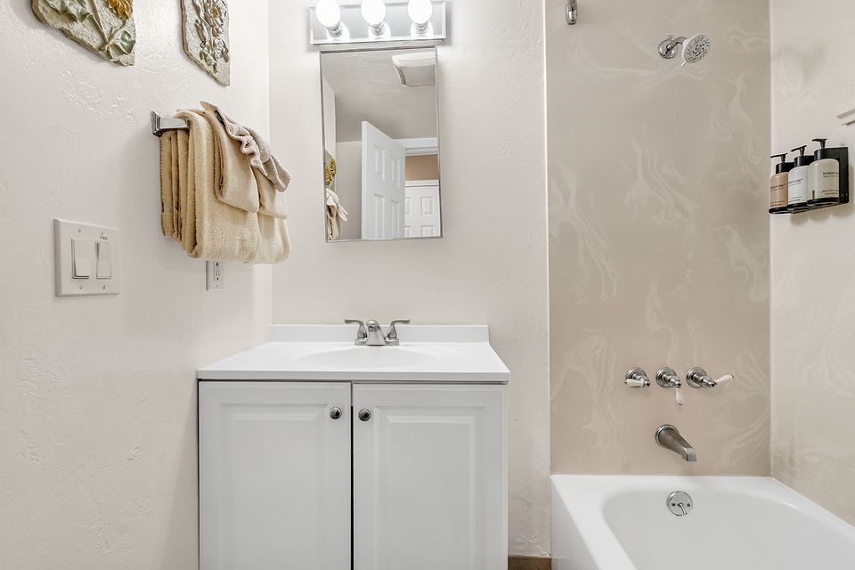 Bathroom with a tub and shower, Unit G at the Beachcomber Inn