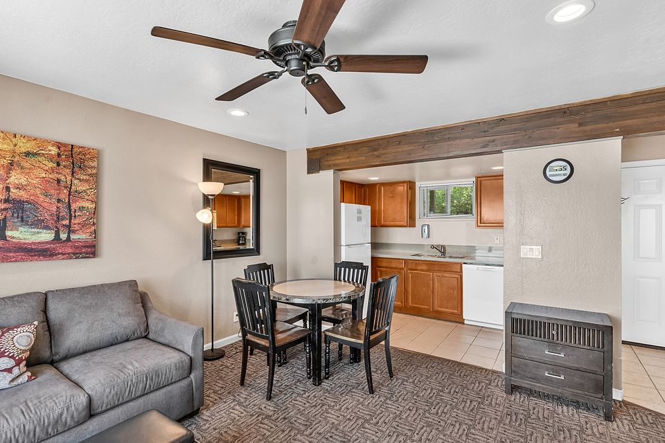 Living room, dining table, and kitchen, Unit H at the Beachcomber Inn