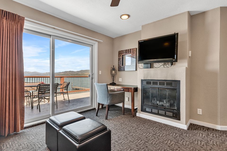 Gas fireplace and the slider to the lake-view deck, Unit I at the Beachcomber Inn