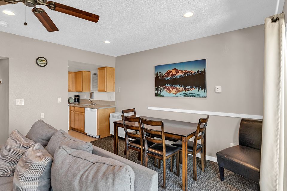 Living room, dining table, and kitchen, Unit K at the Beachcomber Inn