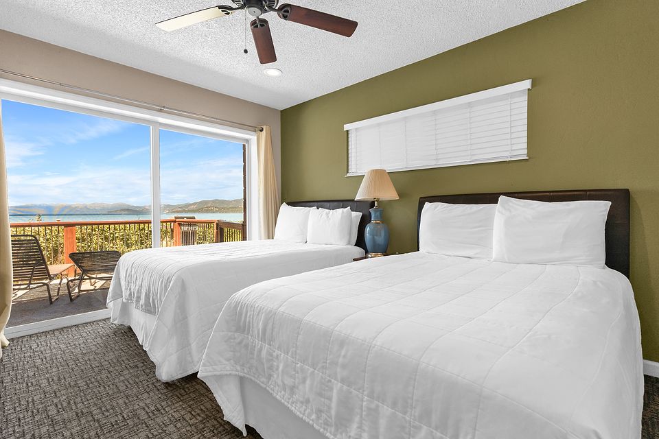 Bedroom with two beds and a view of Lake Tahoe, Unit K at the Beachcomber Inn
