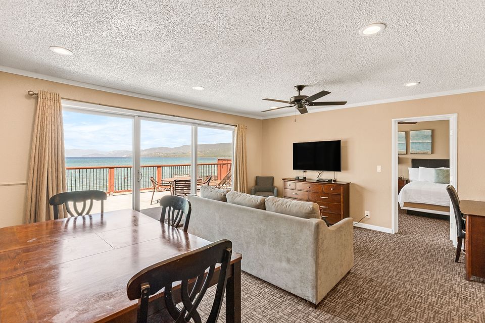 Living and dining area with a view of Lake Tahoe, Unit M at the Beachcomber Inn