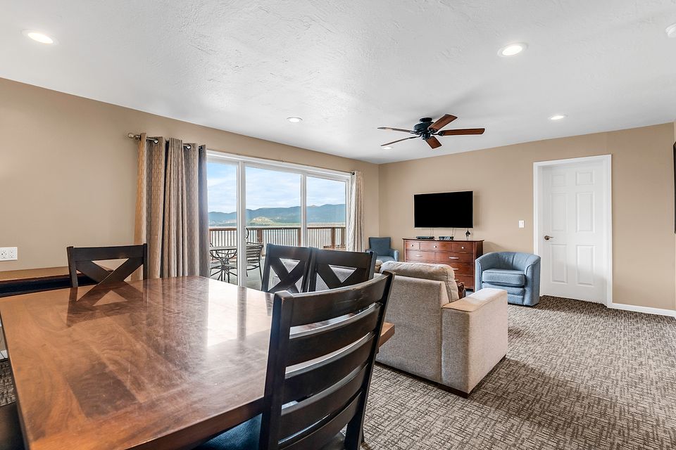 Dining table and living room with a view of Lake Tahoe, Unit N at the Beachcomber Inn
