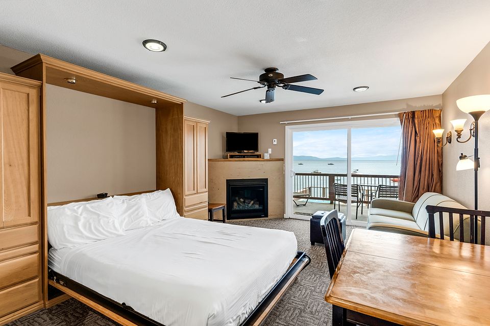 The wall bed down, beside the fireplace and the lake view, Unit O at the Beachcomber Inn
