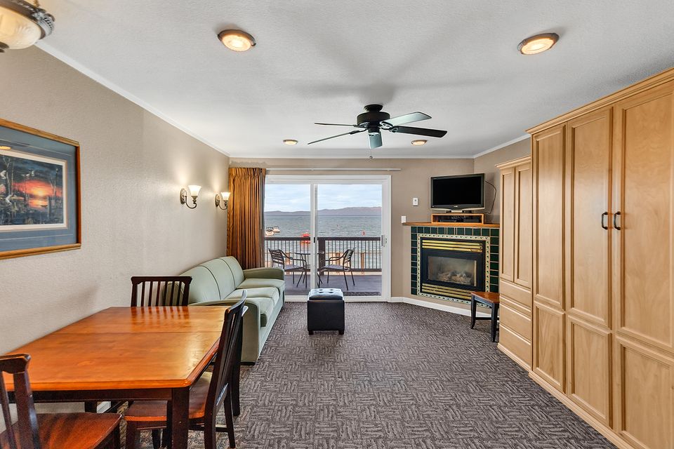 Studio living area with a gas fireplace and a Lake Tahoe view, Unit P at the Beachcomber Inn