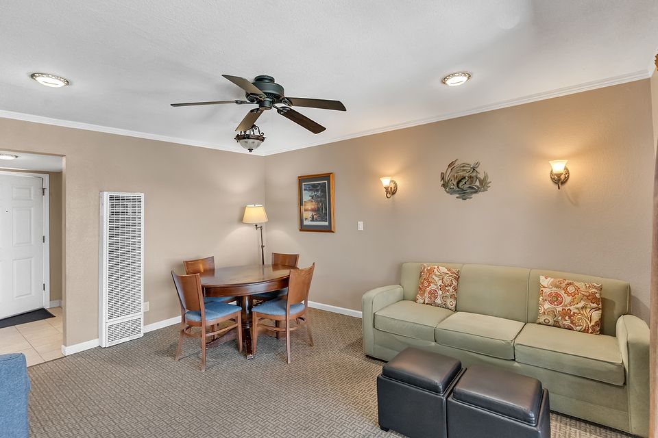 Dining table and living room, Unit Q at the Beachcomber Inn