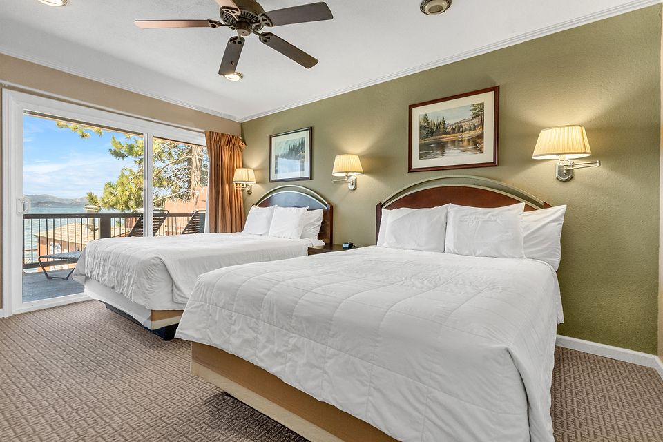Bedroom with two beds and a view of Lake Tahoe, Unit Q at the Beachcomber Inn