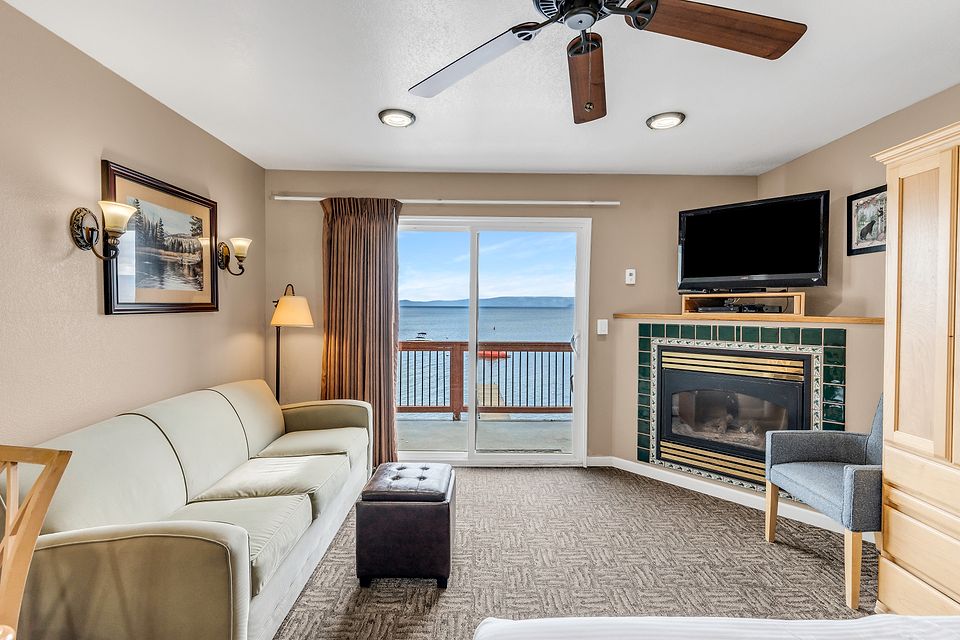 Sofa, fireplace, and the slider to the deck, Unit S at the Beachcomber Inn