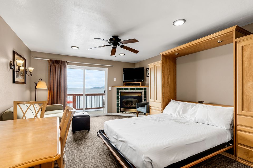 The wall bed down, beside the fireplace and the lake view, Unit S at the Beachcomber Inn