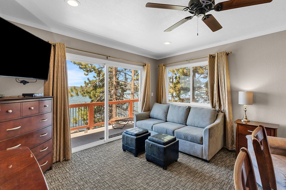 Living room with the lake through the pines, Unit T at the Beachcomber Inn