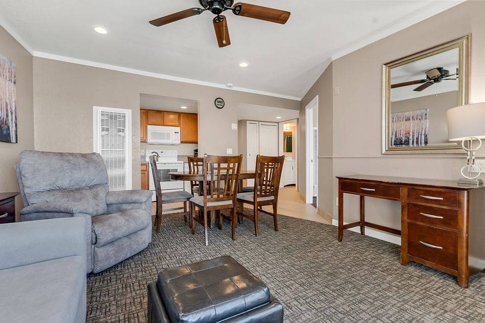 Living room, dining table, and kitchen, Unit T at the Beachcomber Inn