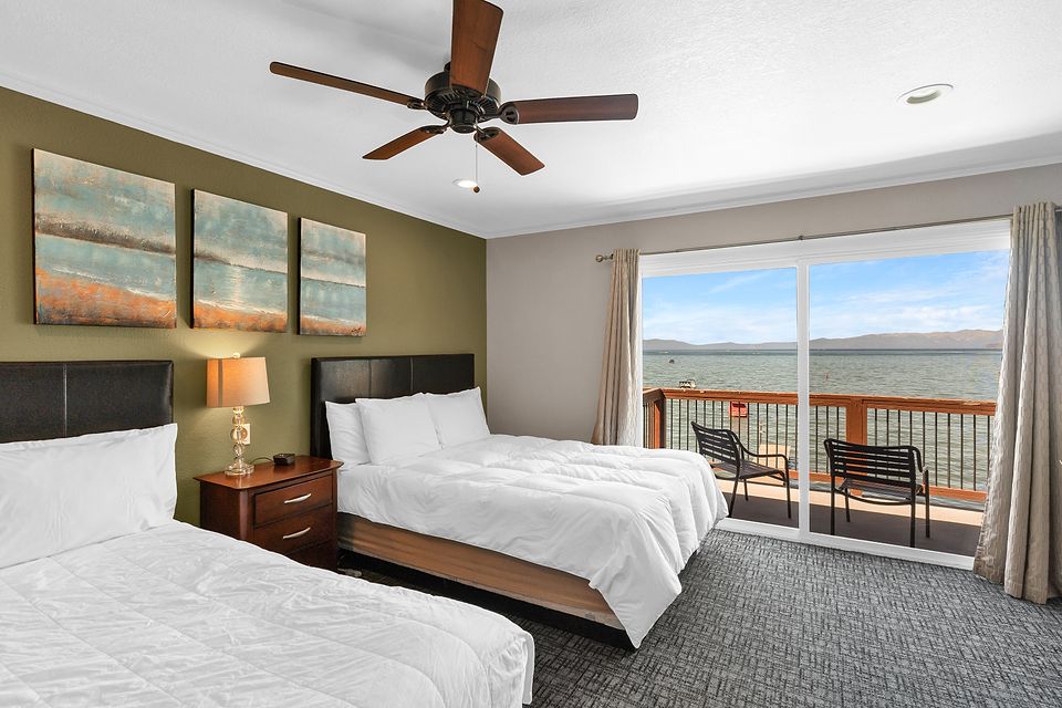 Bedroom with two beds and a view of Lake Tahoe, Unit T at the Beachcomber Inn