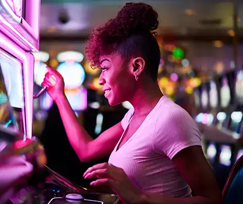 woman playing slot machine